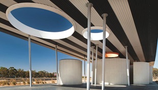 “Steel allowed us to achieve the cantilevered roof, which appears disconnected from the facilities below, as well as the random scatter of columns,” Kosloff says. “There is a dexterity of material and its ability to defy gravity.”